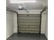 Garage interior with ample space and an automatic door at 2776 Curry Ford Rd # Ge, Orlando, FL 32806