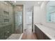 En-suite bath featuring large glass shower with tile accents and double sink at 2926 Sailhouse Drive, St Cloud, FL 34771
