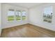 Light-filled bedroom with large windows and hardwood flooring at 2926 Sailhouse Drive, St Cloud, FL 34771