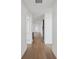 Bright hallway featuring hardwood flooring, leading to various rooms within the home, showcasing its spacious layout at 2926 Sailhouse Drive, St Cloud, FL 34771
