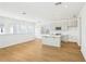 Bright, open-concept kitchen features an island, modern appliances, and ample natural light at 2926 Sailhouse Drive, St Cloud, FL 34771