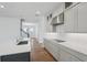 Modern kitchen boasts stainless steel appliances, sleek countertops, and hardwood floors at 2926 Sailhouse Drive, St Cloud, FL 34771