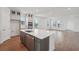Modern kitchen featuring a center island, stainless steel appliances, and stylish cabinetry, perfect for culinary enthusiasts at 2926 Sailhouse Drive, St Cloud, FL 34771