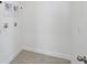 A utility room or laundry area with washer and dryer hook-ups and tile flooring at 2926 Sailhouse Drive, St Cloud, FL 34771