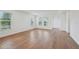 Open living room with hardwood floors, bright natural light, and a welcoming atmosphere for relaxation and gatherings at 2926 Sailhouse Drive, St Cloud, FL 34771