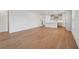 Spacious living area with elegant hardwood floors, seamlessly connecting to the kitchen, ideal for entertaining and Gathering time at 2926 Sailhouse Drive, St Cloud, FL 34771