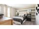 Serene bedroom with neutral tones and soft, natural light streaming through the window at 3005 Namaste Dr, Clermont, FL 34714