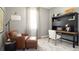 Inviting home office featuring a comfortable leather chair and a functional desk at 3005 Namaste Dr, Clermont, FL 34714