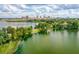 An aerial view showcasing the lake with a skyline backdrop at 3007 Knollwood Cir, Orlando, FL 32804