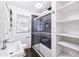 Stylish bathroom with glass shower, and white tiled walls, next to built in storage at 3007 Knollwood Cir, Orlando, FL 32804
