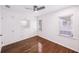 Bedroom features hardwood floors, a ceiling fan, and built in drawers and closets at 3007 Knollwood Cir, Orlando, FL 32804