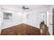 Bedroom featuring wood floors, ceiling fan, a window, and a built-in closet at 3007 Knollwood Cir, Orlando, FL 32804