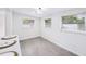 Bright dining area features hardwood floors, three windows, and modern light fixture at 3007 Knollwood Cir, Orlando, FL 32804