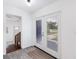 Inviting entryway with french doors, tile flooring, and a view to the front yard at 3007 Knollwood Cir, Orlando, FL 32804