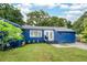 Charming blue single-story home with a well-maintained lawn and fresh landscaping at 3007 Knollwood Cir, Orlando, FL 32804