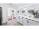 Modern kitchen with quartz countertops, stainless steel appliances, and an open layout to the breakfast nook at 3007 Knollwood Cir, Orlando, FL 32804