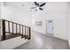 Cozy living room with staircase, tile floors, ceiling fan and lots of natural light at 3007 Knollwood Cir, Orlando, FL 32804