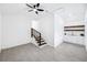 Spacious living room with staircase, tile floors, a ceiling fan and a bar area at 3007 Knollwood Cir, Orlando, FL 32804