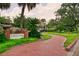 Inviting Albert Park entrance with lush landscaping and brick walkway leading to a charming gazebo at 3007 Knollwood Cir, Orlando, FL 32804