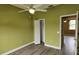 Bedroom with ceiling fan, wood-look floors, and closet at 3222 Reserve Ct, Orlando, FL 32825