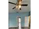 Bright bedroom with a ceiling fan, and open doorways leading to other rooms of the home at 3222 Reserve Ct, Orlando, FL 32825
