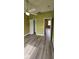 Bedroom with ceiling fan, wood-look floors, closet, and doorway at 3222 Reserve Ct, Orlando, FL 32825