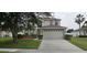 Inviting two-story home featuring a two-car garage and well-maintained front lawn landscaping at 3222 Reserve Ct, Orlando, FL 32825