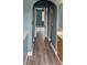 Hallway with hard flooring leading to rooms, offering a view of the natural light at 3222 Reserve Ct, Orlando, FL 32825