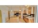 A kitchen features oak cabinets, an island and stainless steel appliances at 3222 Reserve Ct, Orlando, FL 32825