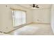 Bright living room with tile floors, large window and ceiling fan at 3222 Reserve Ct, Orlando, FL 32825