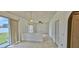 Living room with tile floors and a sliding glass door to the exterior at 3222 Reserve Ct, Orlando, FL 32825