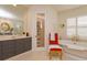 Bathroom with a soaker tub, vanity and walk in shower at 3429 Regal Crest Dr, Longwood, FL 32779