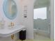 Elegant bathroom featuring a classic sink with gold fixtures, and an arched doorway to the shower at 3429 Regal Crest Dr, Longwood, FL 32779