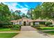 Charming single-story home featuring a beautiful tile roof, manicured landscaping, and a welcoming brick driveway at 3429 Regal Crest Dr, Longwood, FL 32779