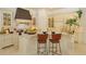 Bright kitchen with a large island, custom cabinetry, and modern appliances at 3429 Regal Crest Dr, Longwood, FL 32779