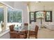 Open-concept living and dining area with a fireplace and stunning natural light at 3429 Regal Crest Dr, Longwood, FL 32779