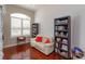 Home office with bright natural light, hardwood floors and bookshelves at 3429 Regal Crest Dr, Longwood, FL 32779