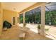 Enclosed patio with tile flooring, seating area, and views of lush greenery at 3429 Regal Crest Dr, Longwood, FL 32779