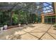 Enclosed patio showcasing tile flooring and lush landscaping at 3429 Regal Crest Dr, Longwood, FL 32779