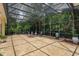 Enclosed patio with tiled flooring, and views of a tropical landscape at 3429 Regal Crest Dr, Longwood, FL 32779