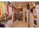 Spacious walk-in closet with clothing racks, shelving and a bench at 3429 Regal Crest Dr, Longwood, FL 32779