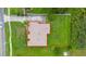 An aerial view shows the layout of this home's roof and the surrounding property at 3779 N Econlockhatchee Trl, Orlando, FL 32817