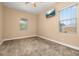 Inviting bedroom with neutral walls, carpet, ceiling fan, and a TV for entertainment at 3779 N Econlockhatchee Trl, Orlando, FL 32817