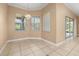 Cozy dining area with chandelier lighting and large windows offering views of the greenery outside at 3779 N Econlockhatchee Trl, Orlando, FL 32817