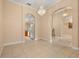 Inviting dining area with tile floors, chandelier lighting, and arched doorways to adjacent rooms at 3779 N Econlockhatchee Trl, Orlando, FL 32817