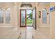 Bright foyer featuring tiled floors and an open front door with views of the outdoors at 3779 N Econlockhatchee Trl, Orlando, FL 32817