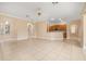 Open floor plan with tile flooring connecting living room, kitchen, and dining areas, great for entertaining at 3779 N Econlockhatchee Trl, Orlando, FL 32817