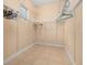 Spacious walk-in closet features adjustable shelving and ample storage, with natural light from the window at 3779 N Econlockhatchee Trl, Orlando, FL 32817