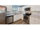 Modern kitchen with white cabinets, stainless steel appliances, and a subway tile backsplash at 395 Alcazar Ave, De Leon Springs, FL 32130