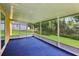 Enclosed lanai has sliding doors to backyard at 395 Alcazar Ave, De Leon Springs, FL 32130